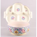 A 1950s Poole pottery bowl, 13" dia, a companion hors d'oeuvres dish, a floral bowl, 8 3/4" dia, and