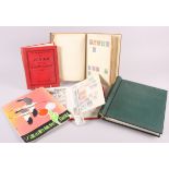 An early 20th century stamp album with colonial and world stamps, two other albums, a stock book and