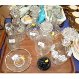 A number of cut glass decanters and stoppers, a glass paperweight and a glass bowl