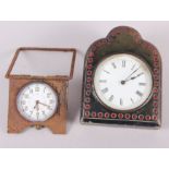 A leather cased travelling clock with white enamel dial and Roman numerals and another travelling