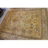 A Persian design rug with scroll ground and an umber ground, 115" x 95" approx
