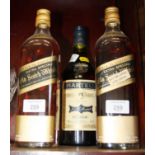 A litre bottle of Martell Cognac, two 75cl bottles of Johnnie Walker Black Label Extra Special Old
