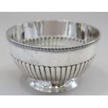 A Victorian silver sugar bowl with half-fluted decoration and a small silver milk jug, 7.6oz troy