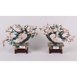 A pair of Chinese rose quartz and jadeite model trees, on hardwood stands