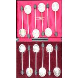 A cased set of six silver coffee bean spoons and six similar coffee bean spoons