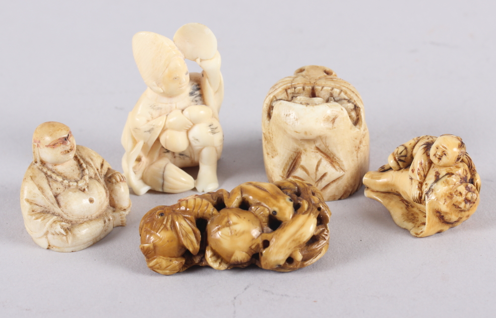 Four Oriental carved netsukes and a figure of Hotei