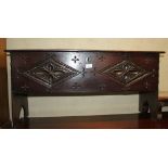 A chip carved planked coffer, on panel end supports, 38" wide