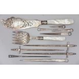 A pair of silver plated fish servers with pierced and engraved decoration and mother-of-pearl