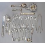 A selection of silver tea and coffee spoons and various other silver and white metal flatware,