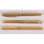 A Shaeffer gold plated fountain pen, a gold plated Cartier ball point pen and a similar felt tip