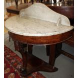 A late 19th century mahogany and marble top semicircular Duchess washstand, 35" wide x 17 1/2"
