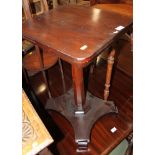 A mahogany rectangular occasional table, on octagonal column and quadraform base, 18" wide, and a