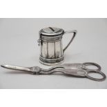 A pair of silver grape scissors and a Continental white metal money box, formed as a lidded tankard