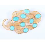 An Eastern yellow metal leaf brooch set turquoise cabochons, 16.6g gross