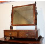 A late Georgian mahogany and ebony strung bowfront swing frame toilet mirror, on plateau base,