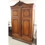 A 19th century French walnut armoire enclosed two panelled doors over one drawer, on bracket feet,
