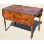 A late 19th century mahogany Pembroke table, fitted one drawer with ceramic knobs, on slender turned