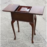 A mid 20th century mahogany work table with sliding top, on cabriole supports, 18" wide x 12 1/2"