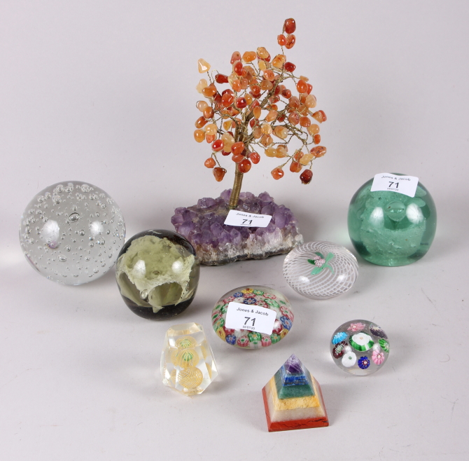 An amethyst and carnelian tree, 7 1/2" high, seven paperweights and a pyramid-shaped semi-precious