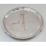 A circular silver card tray with gadrooned border, 16.3oz troy approx