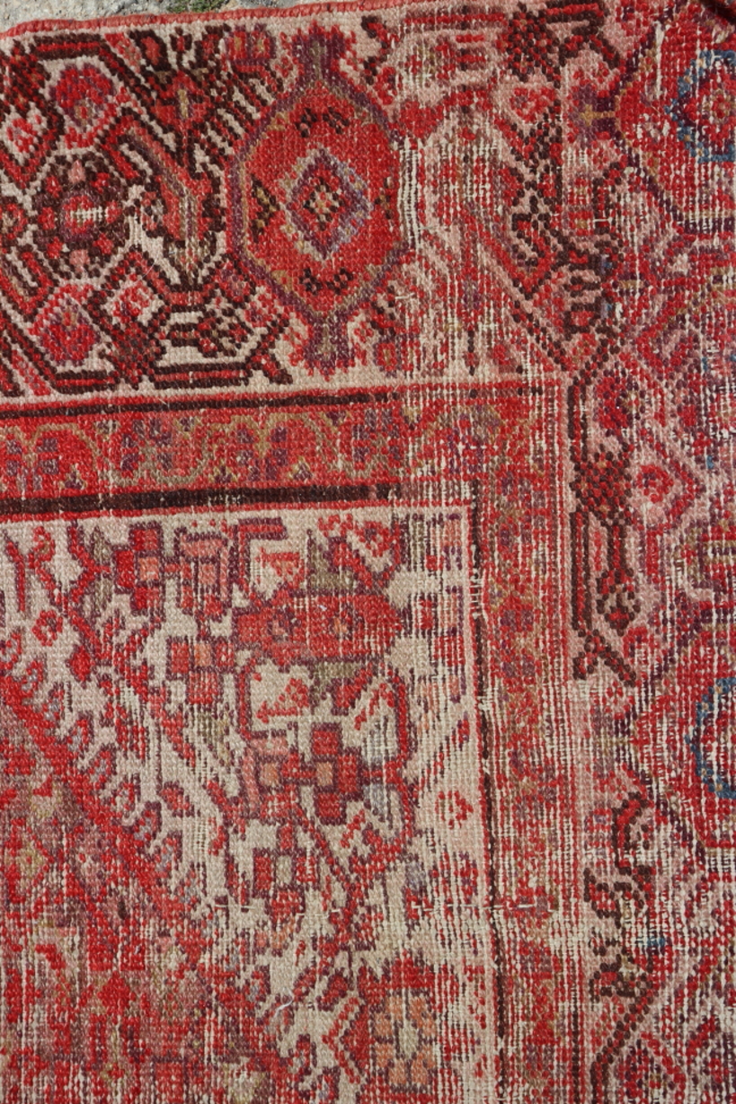 A Turkoman type rug, with all-over geometric design in shades of red, 68" x 50" approx (worn) - Image 2 of 3