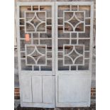 A pair of 19th century painted openwork "screen" doors, 79 1/2" high x 27 1/2" wide (Please note