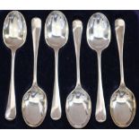 A cased set of six silver teaspoons, two cased sets of six silver demitasse coffee spoons and a