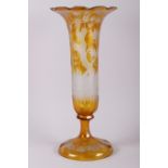A Bohemian 19th century amber overlaid and etched glass trumpet vase, decorated stags, 16 1/2"
