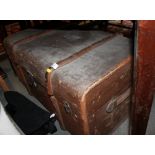 A canvas travelling trunk with wooden and metal fittings, 32" wide and a metal strong box