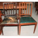 A pair of mahogany vertical rail back side chairs with green leather "drop-in" seats, on square