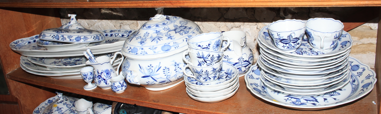 A quantity of Meissen "Onion" pattern china, including platters, tureens, jugs, plates and similar