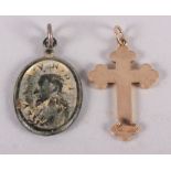A pilgrim's bronze gilt 17th century pendant and a yellow metal cross, stamped 9ct