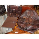A Rowallan brown leather travel bag, a similar rucksack, an Estero brown leather folio and a leather