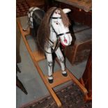 A grey painted rocking horse, 62" wide