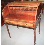 An early 19th century mahogany cylinder bureau with fitted interior, on spiral turned supports, in