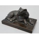 G Gorrero?: a bronze figure of a recumbent dog, on plinth base, 2 1/4" high