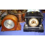 An Art Deco walnut cased mantel clock and a slate mantel clock of architectural form