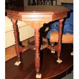 A mahogany octagonal two-tier, occasional table with galleried undertier, on turned castored