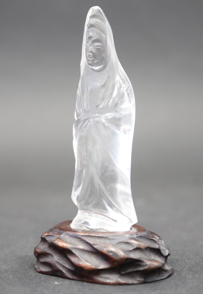 A rock crystal figure of a Kuan Yin, on hardstone stand, 3" high