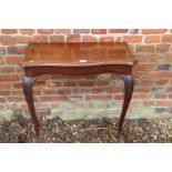 An Edwardian walnut serpentine front console table and three cane seat bedroom chairs