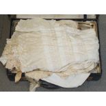 An Edwardian christening cape, a quantity of baby robes and crib trimmings