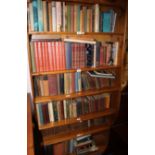 A collection of uniformly bound books of the Bible and other general vols