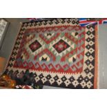 A Caucasian kelim rug with two medallions to the ground, 62" x 42 1/2" approx