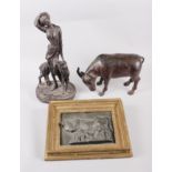 A patinated model of a buffalo, 6 1/2" high, a cast iron plaque of a cow and calf, in gilt frame,