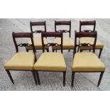 A set of six William IV mahogany bar back dining chairs with stuffed over leather seats, on turned