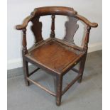 A late Georgian provincial corner chair with splat back and panel seat, on chamfered supports