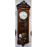 A Vienna type regulator wall clock in figured walnut case, 48" high