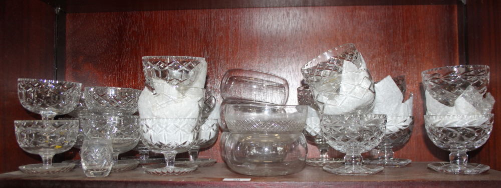 A quantity of cut glass sundae dishes and finger bowls