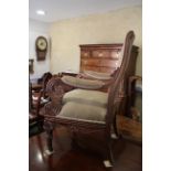 A Regency carved mahogany open armchair with acanthus decoration, in the manner of Charles Tatham,