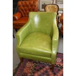 **A retro 1960s design green leather tub armchair, on square taper supports (**Please note this